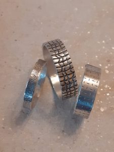 Embossed silver rings