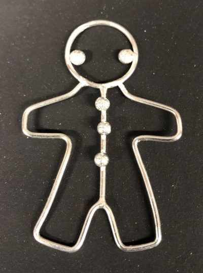 Silver gingerbread man by Henry Cooke